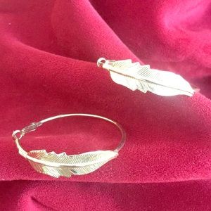 Gold metal feather hoop earrings